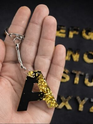 Porte cles initiales noir et or
